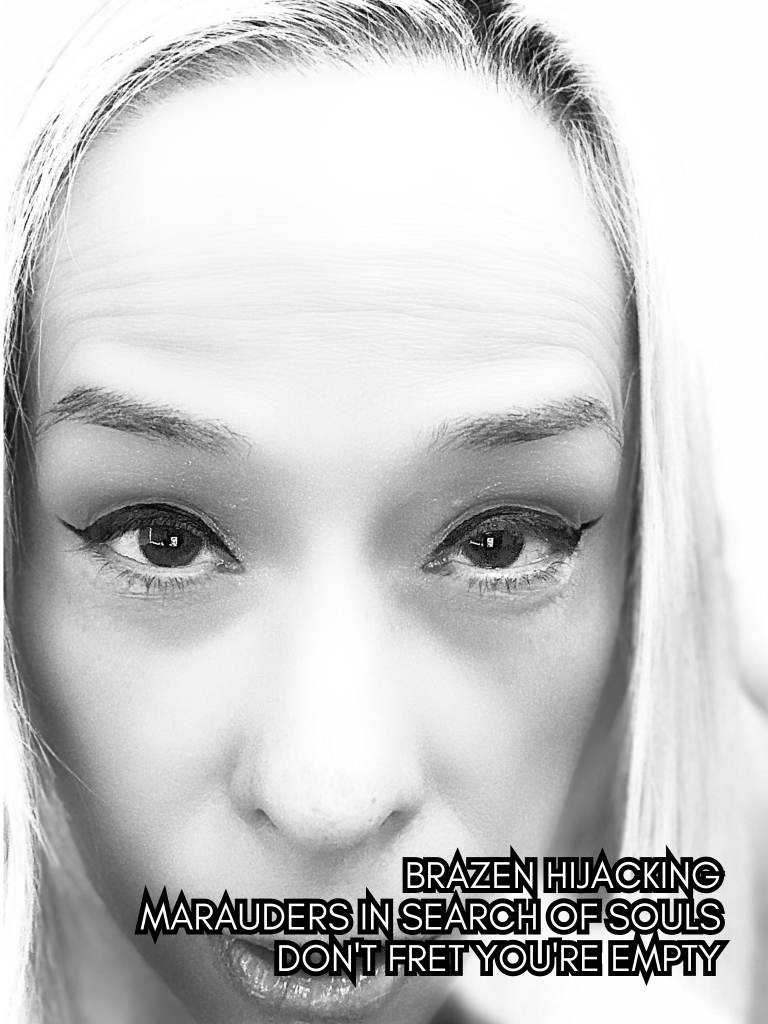 High-contrast black and white self-portrait by Baroque Medusa showing a direct stare, paired with a haiku about emptiness, intrusion, and inner resilience.