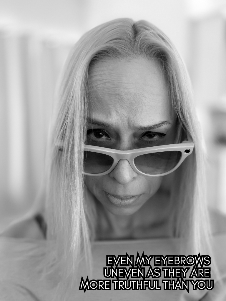 Black-and-white portrait of Baroque Medusa wearing glasses and looking downward, overlaid with a haiku about uneven brows and uncomfortable honesty.