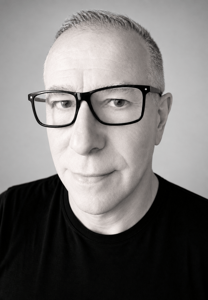 Black-and-white portrait of photographer and iPhoneographer James Bacchi wearing dark glasses.